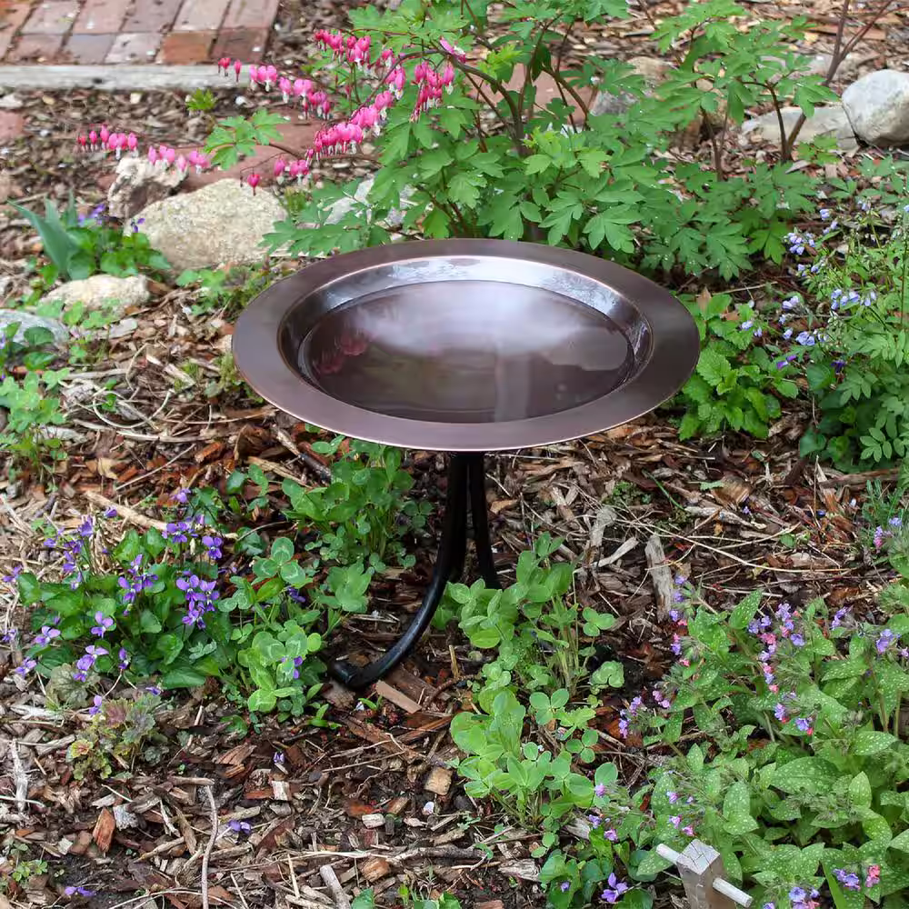 ACHLA DESIGNS 18 in. Dia, Round Antique Finished Brass Classic Copper Iron Birdbath with Tall Black Wrought Iron Tripod Stand
